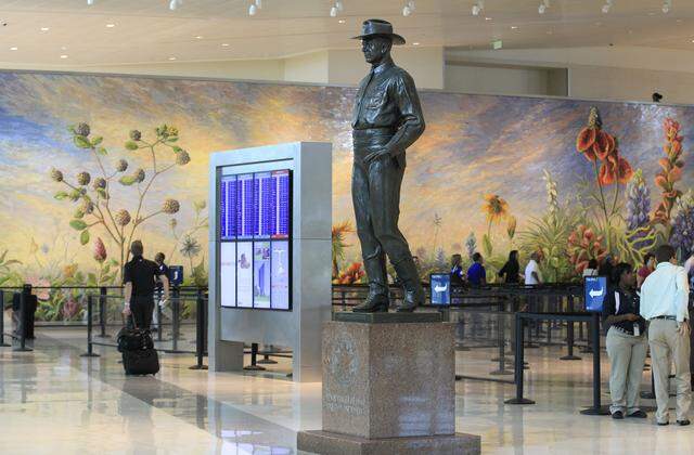 The 1961 “Texas Ranger of Today” statue of a Texas Ranger stood in the Love Field terminal in Dallas on Thursday, Sept. 26, 2014.
